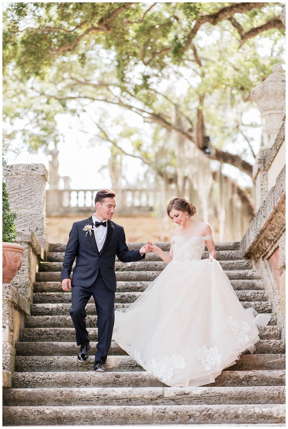 bride and groom holding hands walking down steps at Miami Vizcaya Museum Wedding
