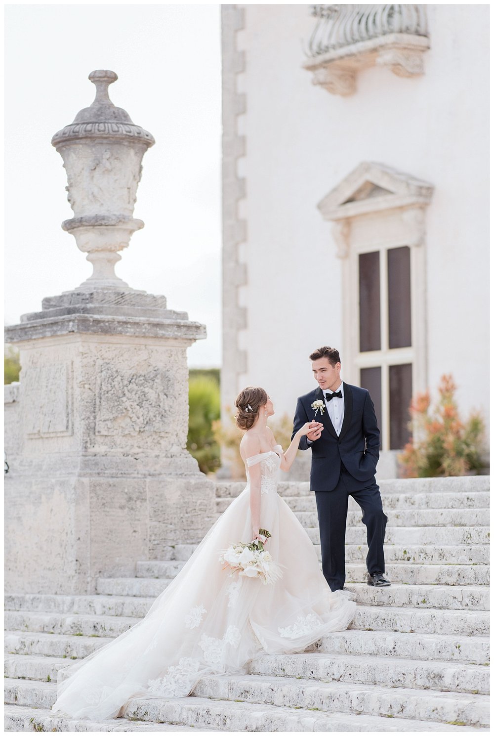 bride and groom holding hands on steps at Miami Vizcaya Museum WeddingWedding