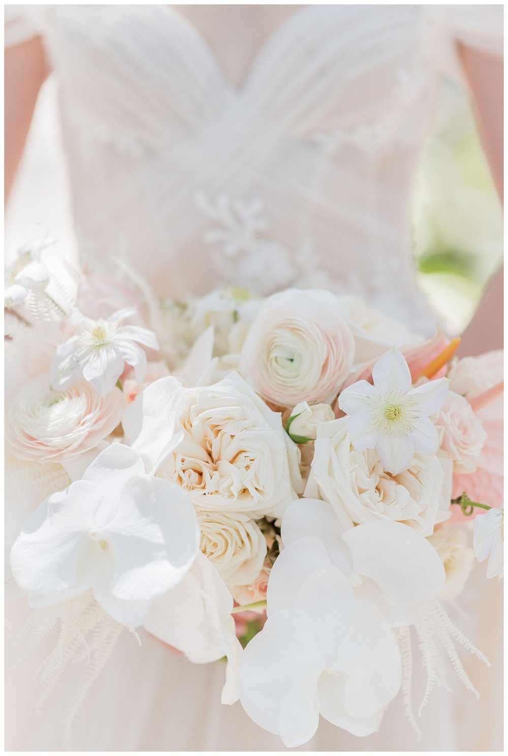 bride holding all white bouquet detailed shot