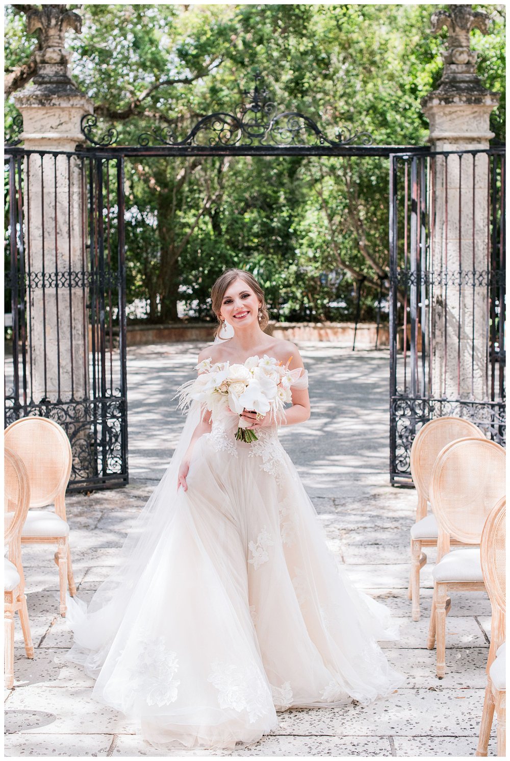 bridal portrait in front of black gates at Miami Vizcaya Museum Wedding