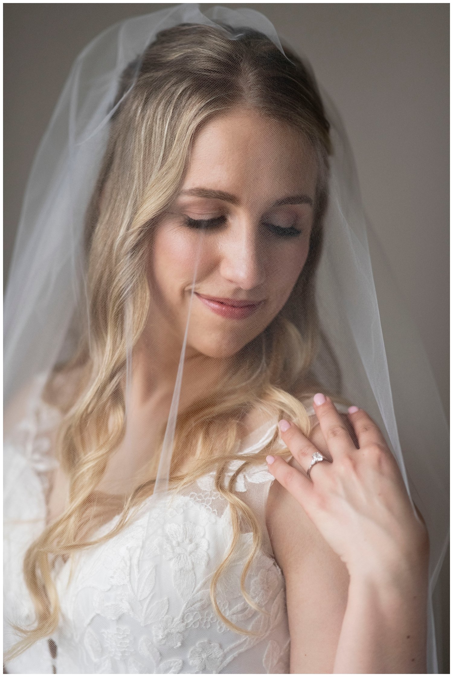 New England wedding photographer bridal portrait closeup of bride looking at hand on shoulder