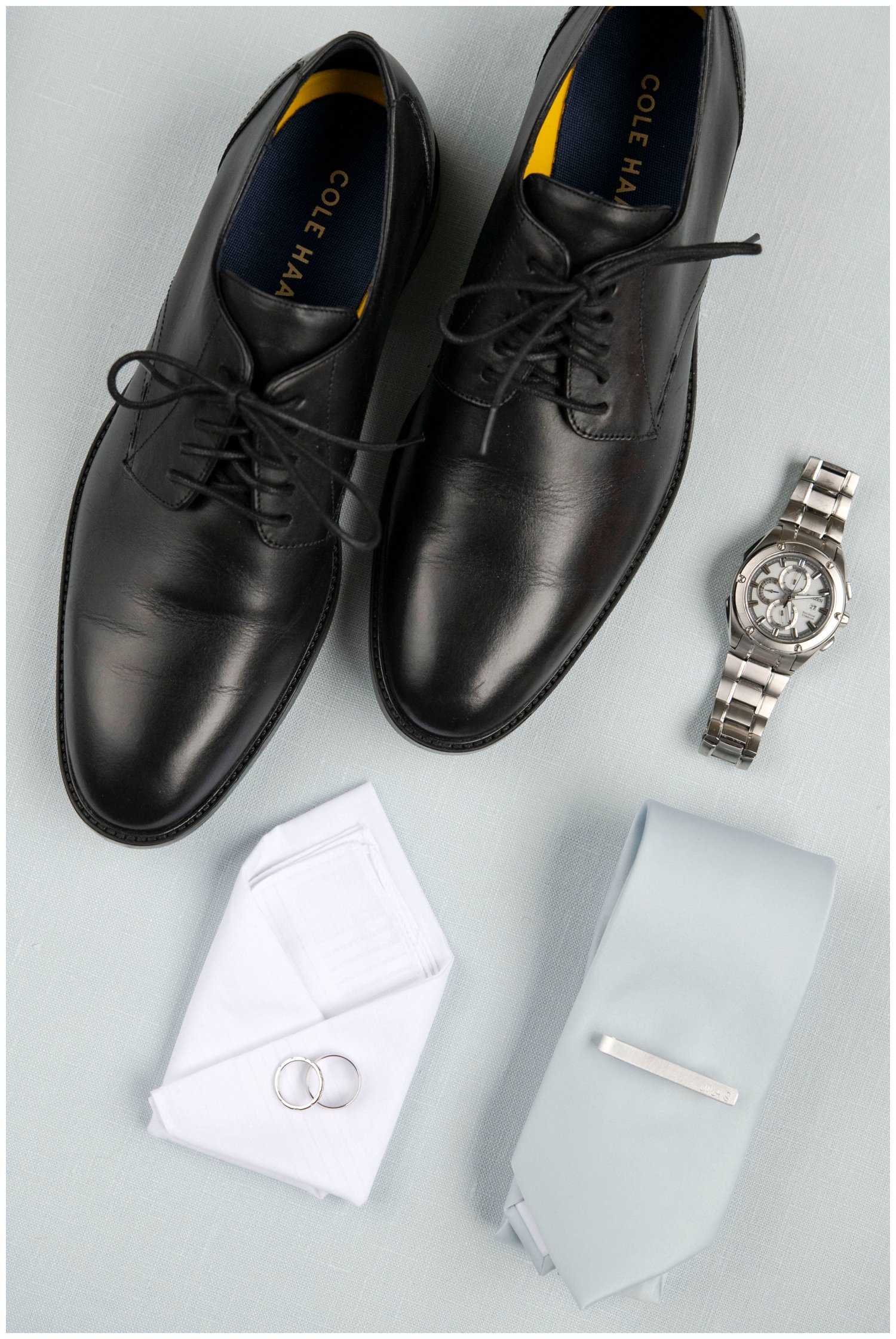 groom details flatlay with shoes and tie