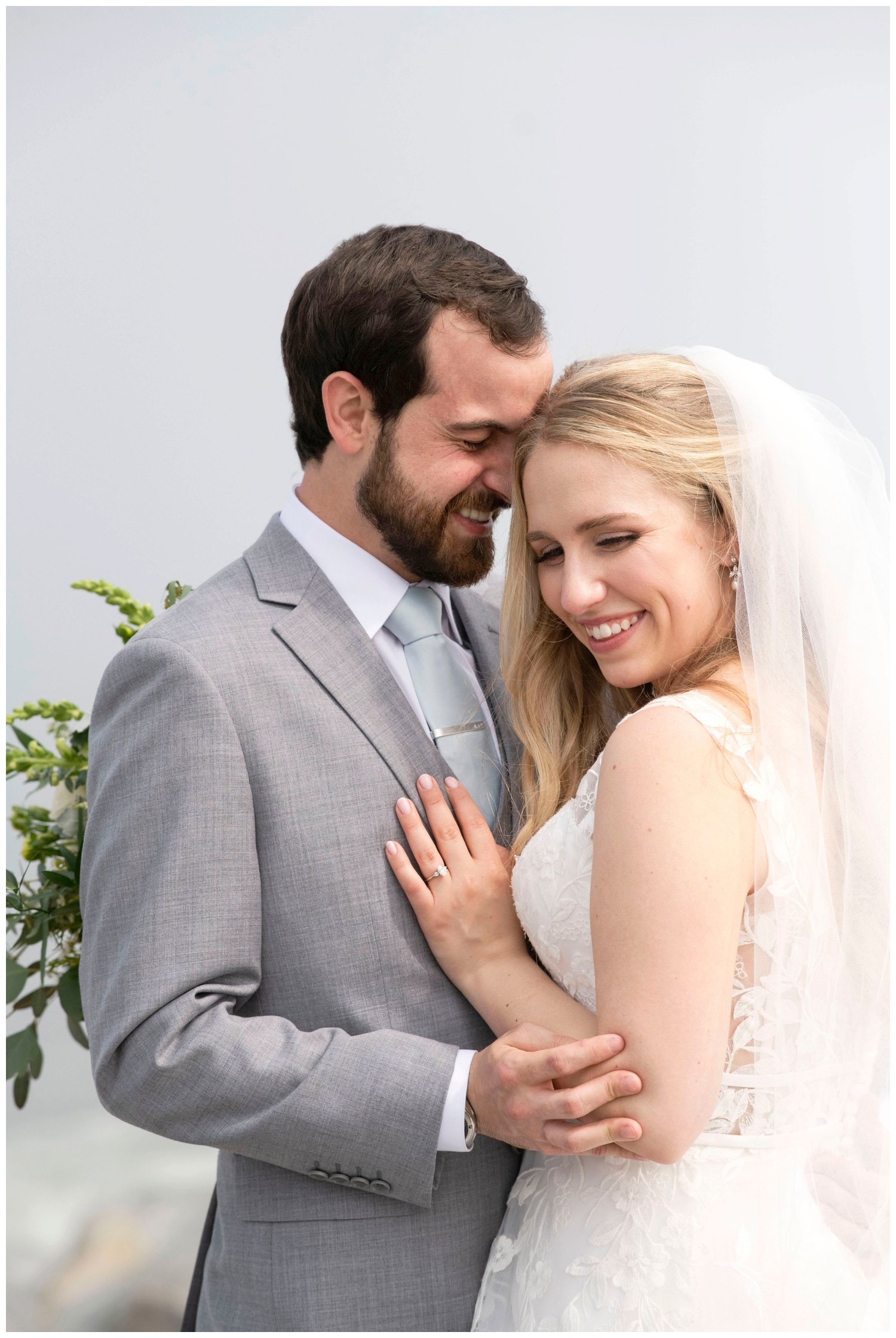 bride and groom portrait outside of The River Club in New England