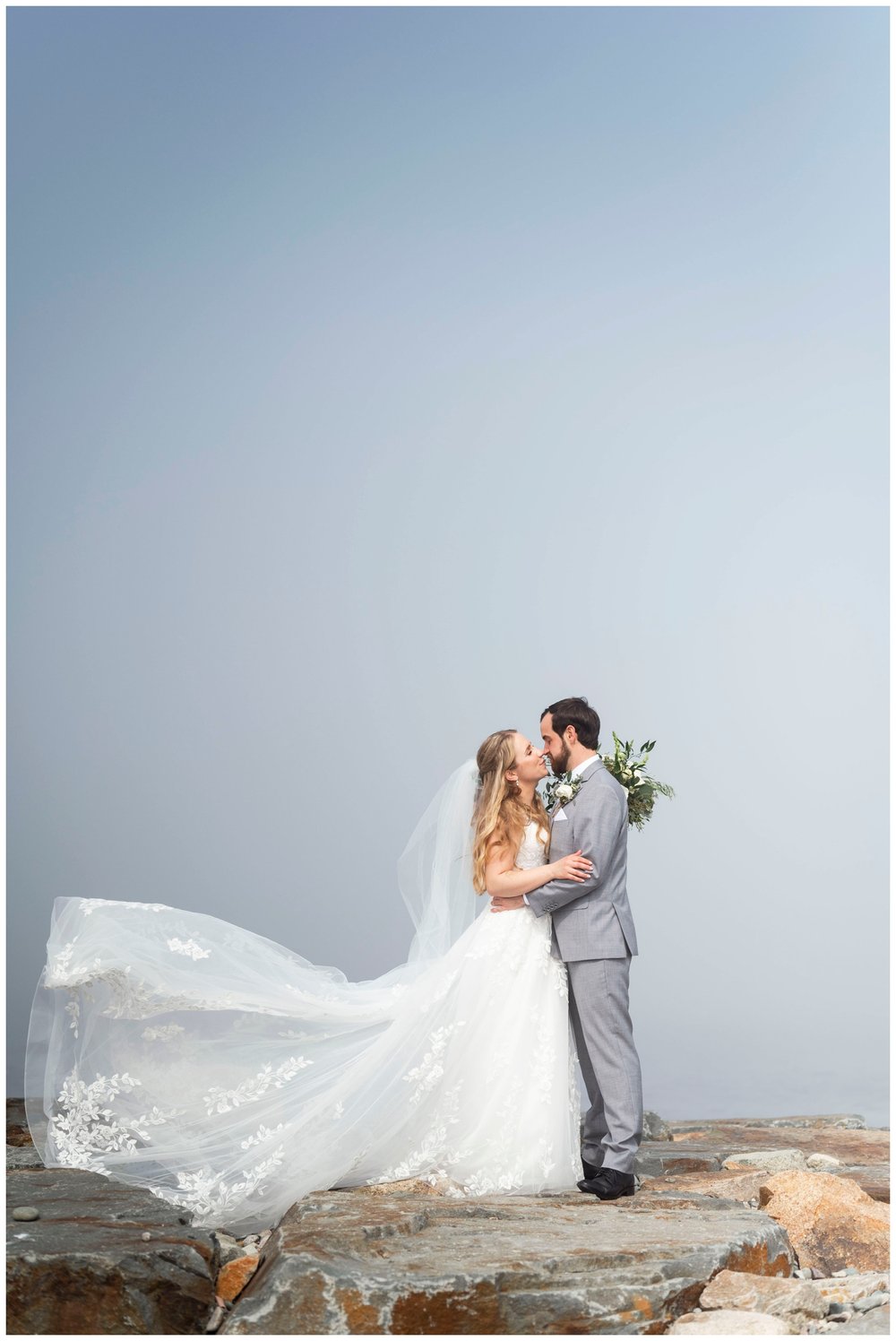 bride and groom portrait with veil swoop for New England wedding photographer