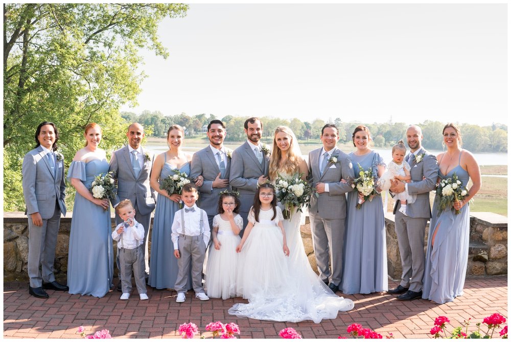 full bridal party smiling for New England wedding photographer