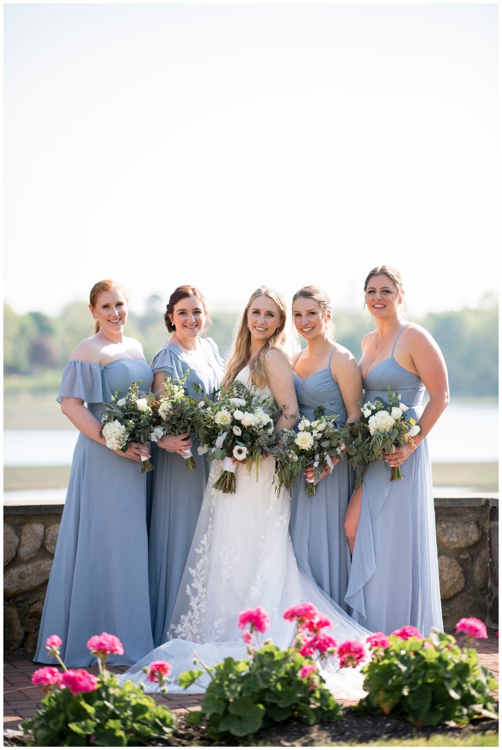 bride posing with bridesmaids outdoors in New England, Massachusetts