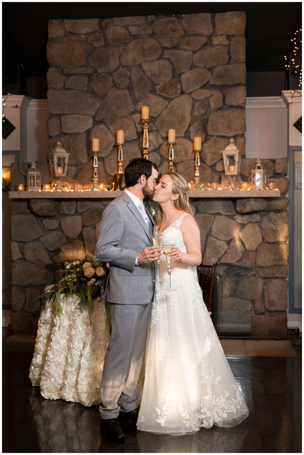 bride and groom kissing inside The River Club reception for New England wedding photographer