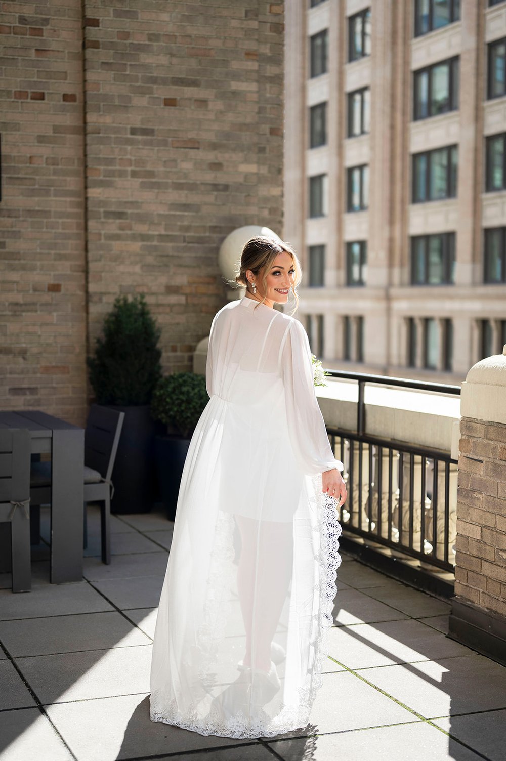 bride posing on rooftop for bridal portraits