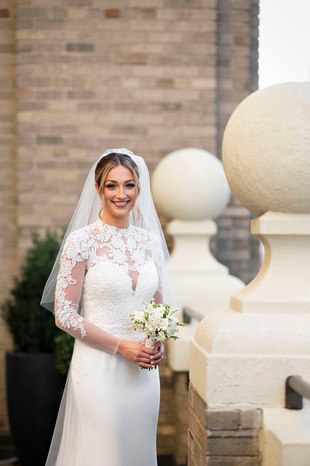 bridal portraits on rooftop with lace wedding dress