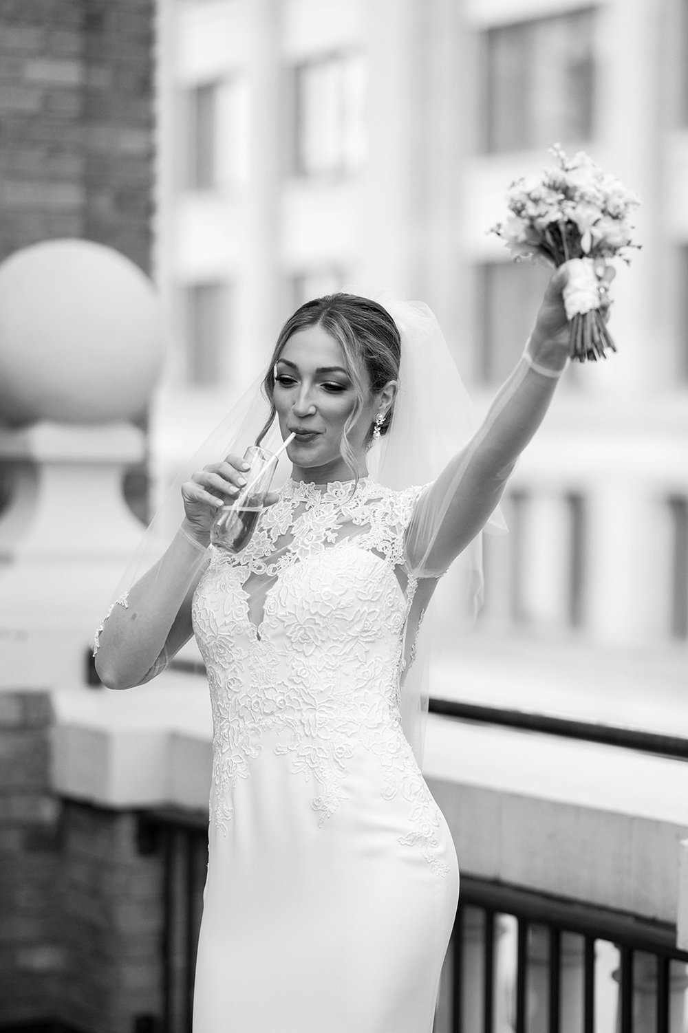 bridal portraits on rooftop with lace wedding dress