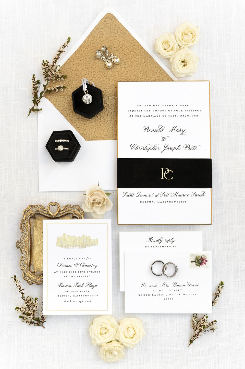 wedding detail flat lay photos with rings invitations and floral