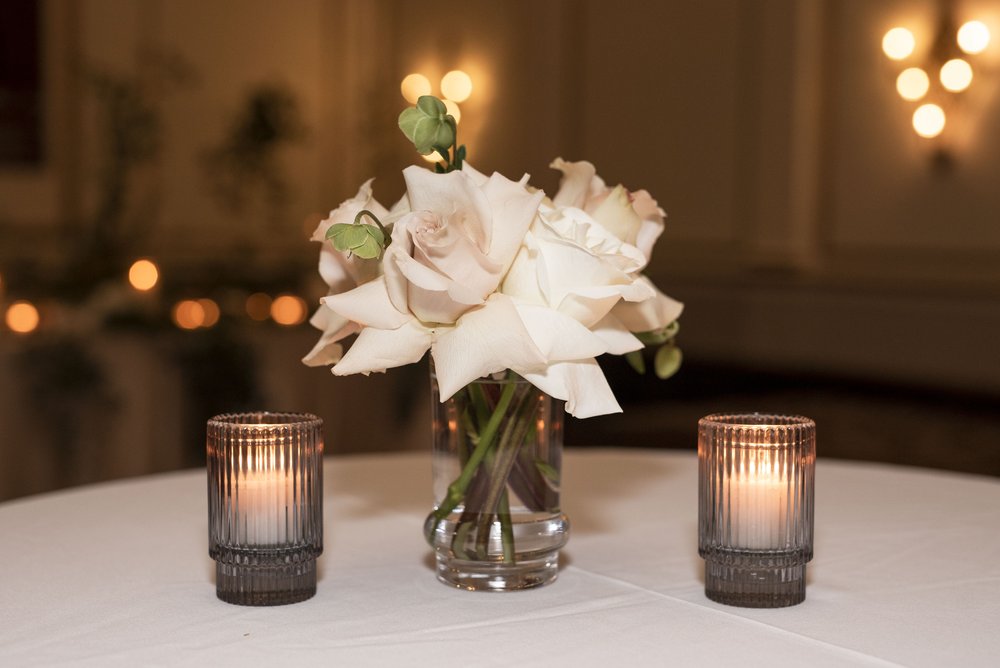 wedding flowers and candles at wedding reception