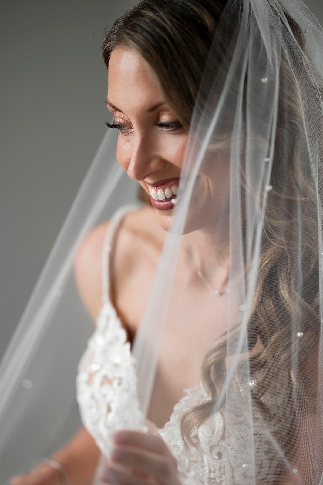  bride posing in wedding dress during newport wedding day 