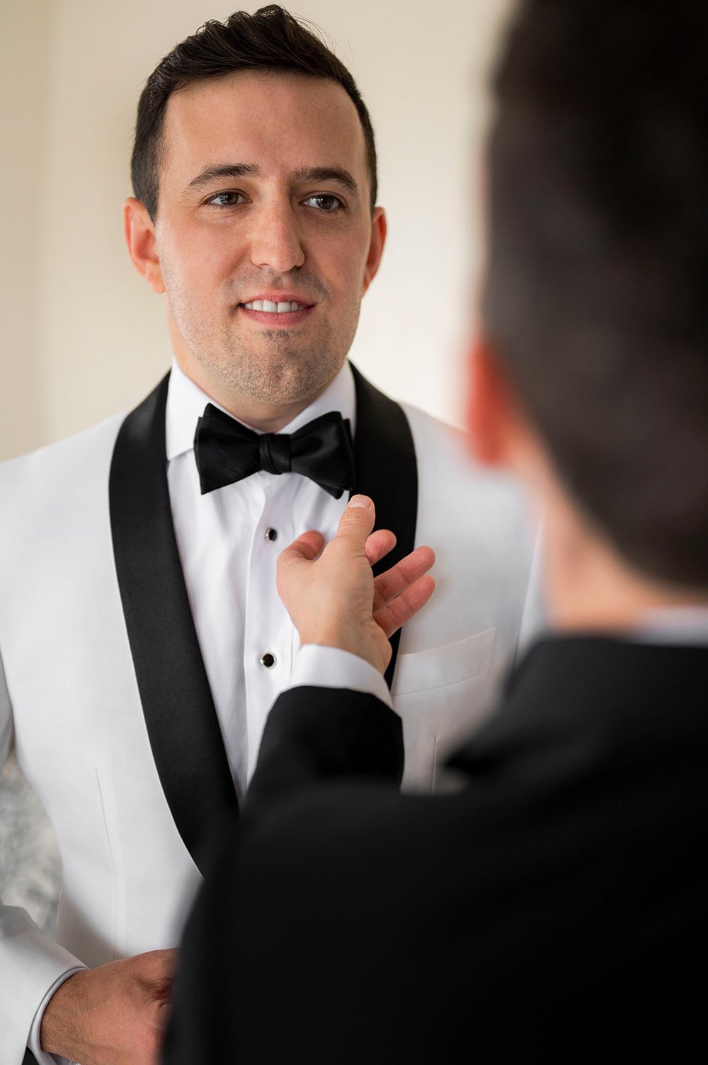  groom getting ready during newport wedding day 