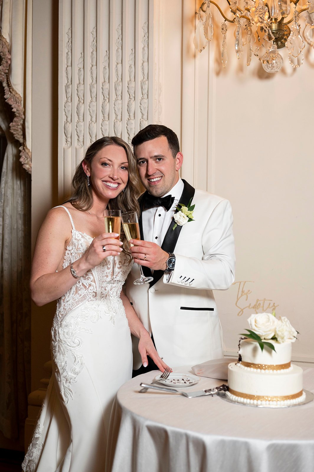  bride and groom cutting wedding cake 