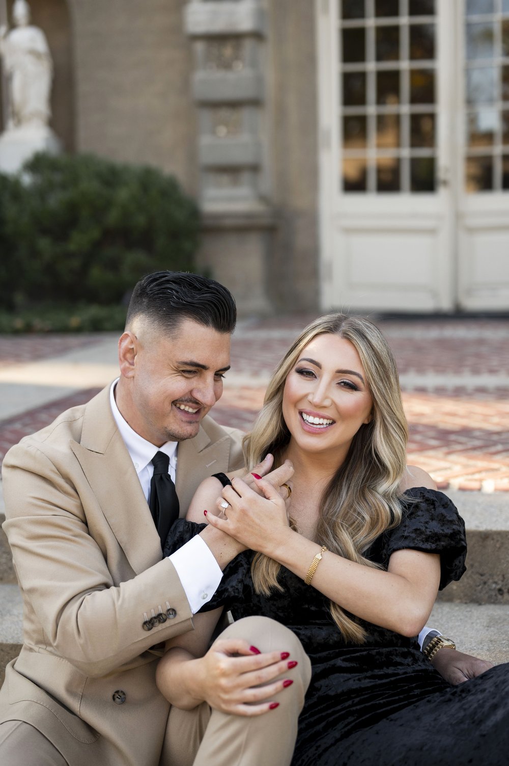 couple laughing with each other during engagement photoshoot