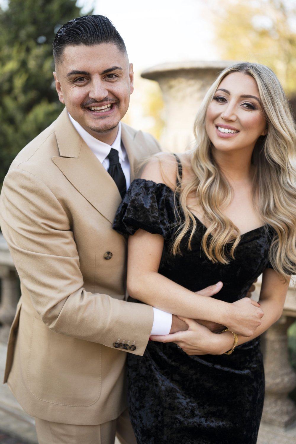 couple holding each other in crane estate