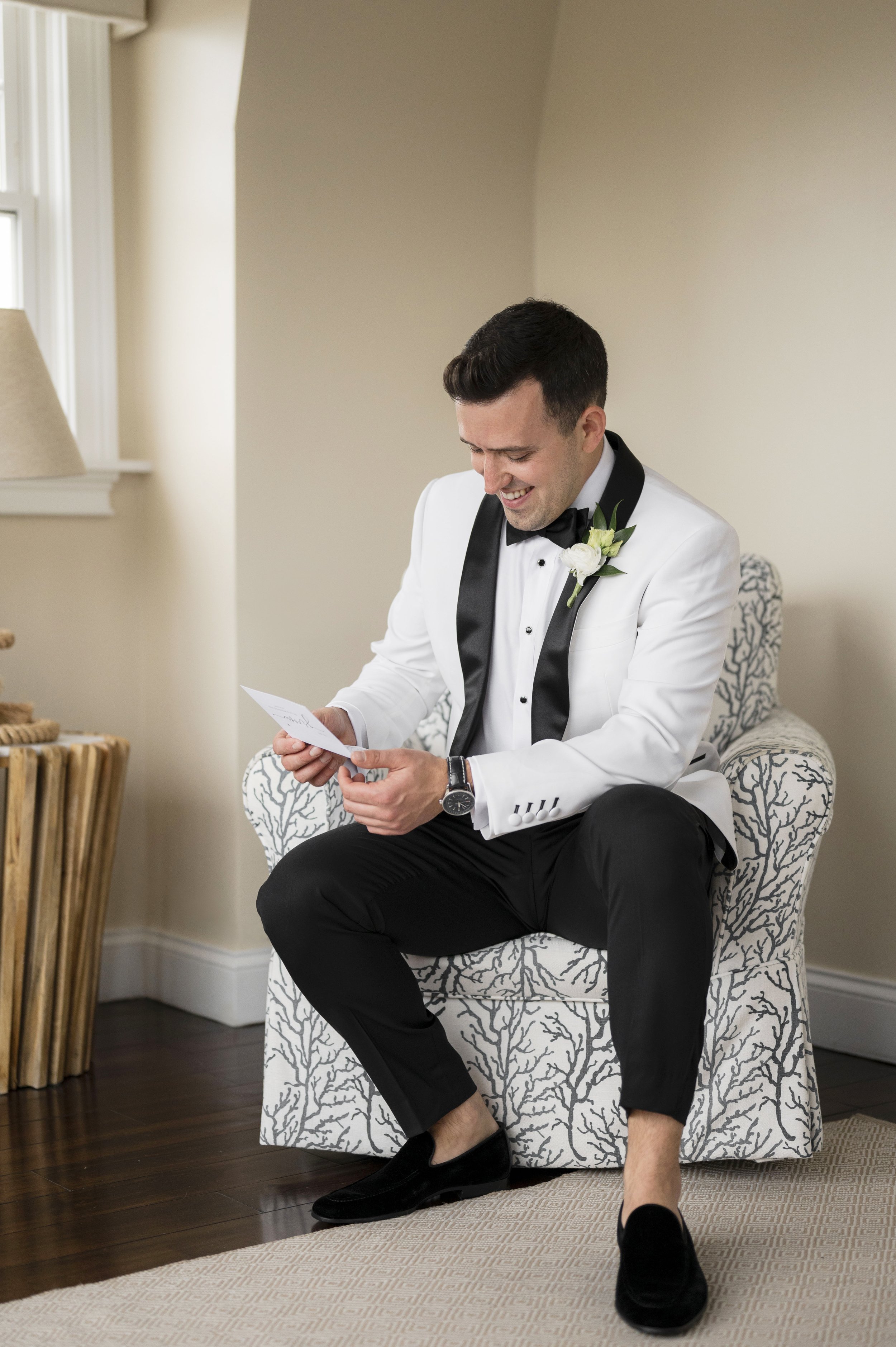 groom posing for wedding photos during newport wedding day