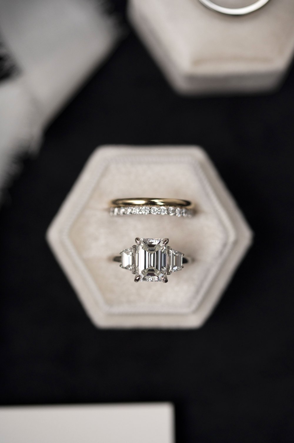 wedding bands and engagement  ring in a ring box