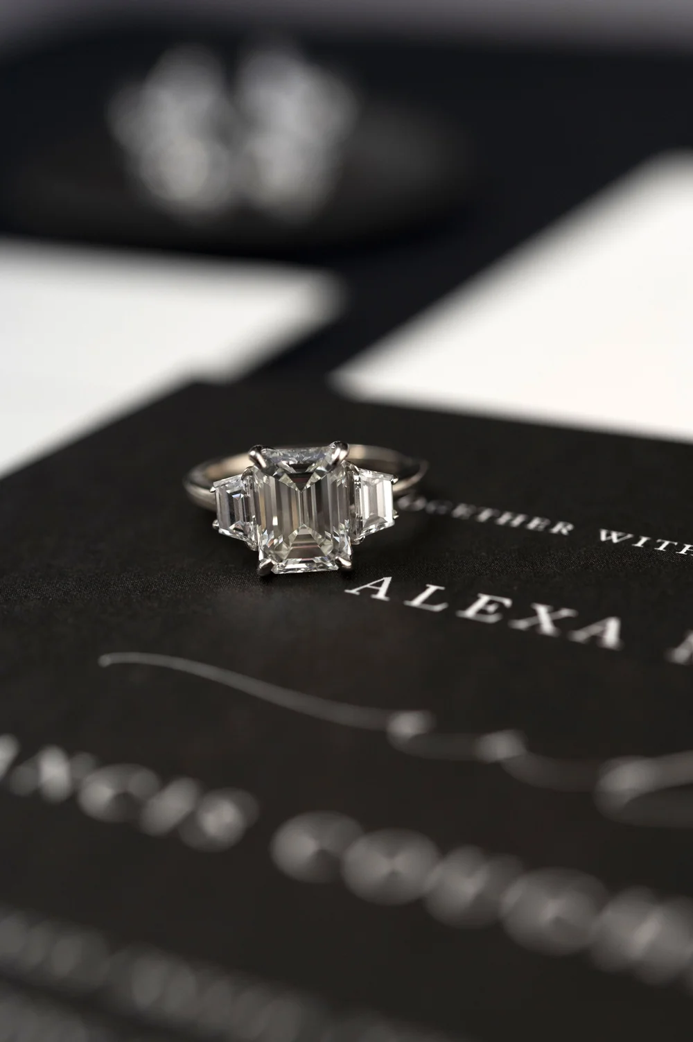 engagement ring on a wedding invitation