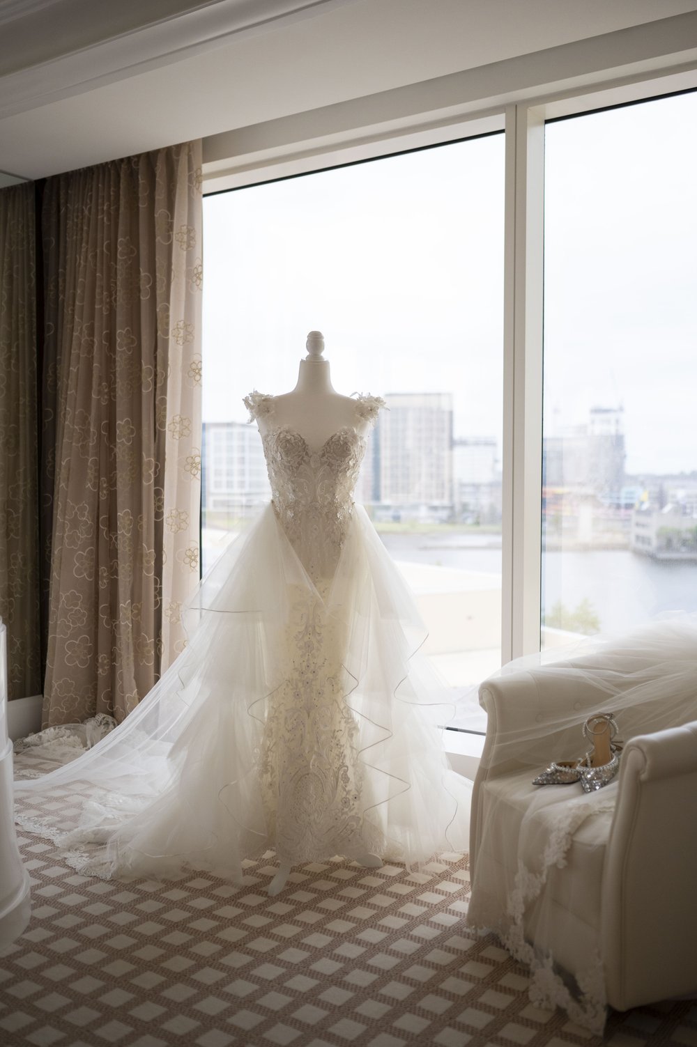 wedding dress on a mannequin  in a hotel suite