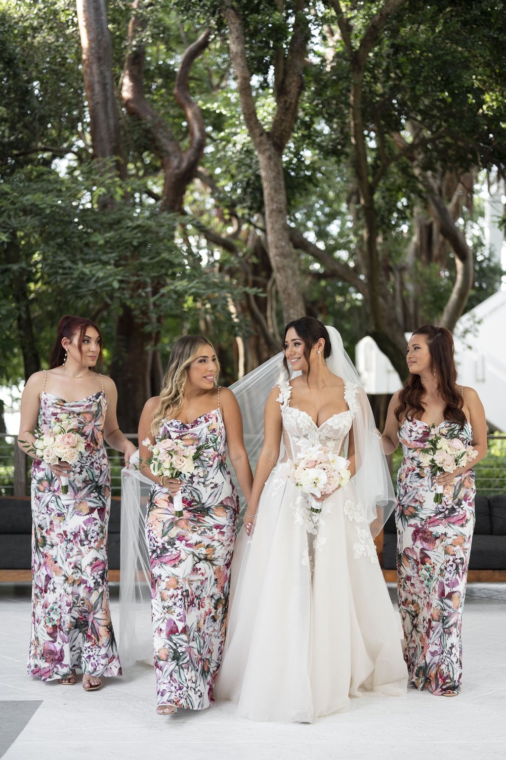 bride and bridesmaids walking together 