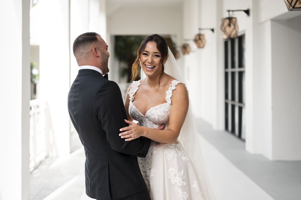 bride and groom hugs each other of exitment