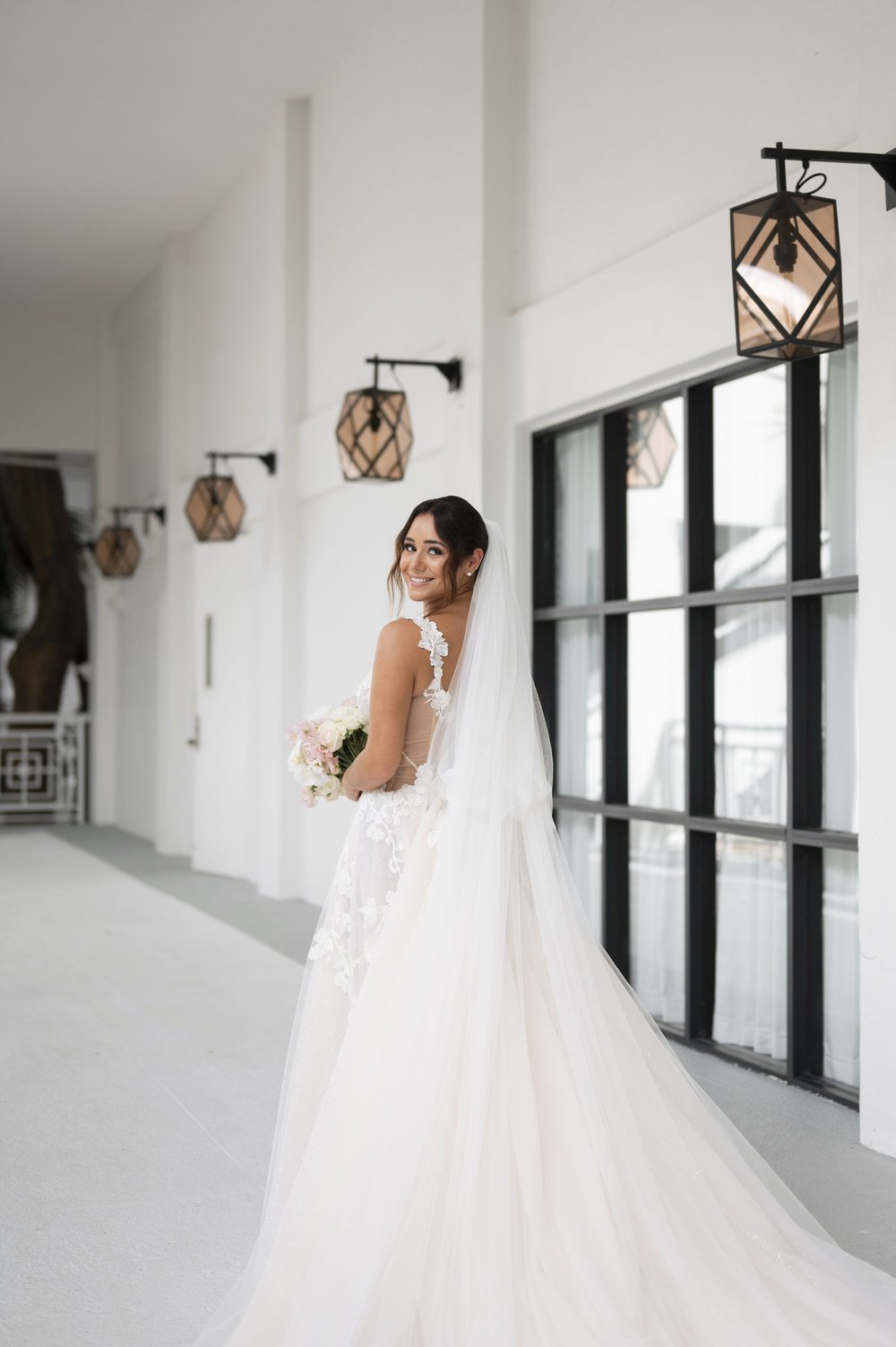 bride walking away in a white side of the baker's cay resort