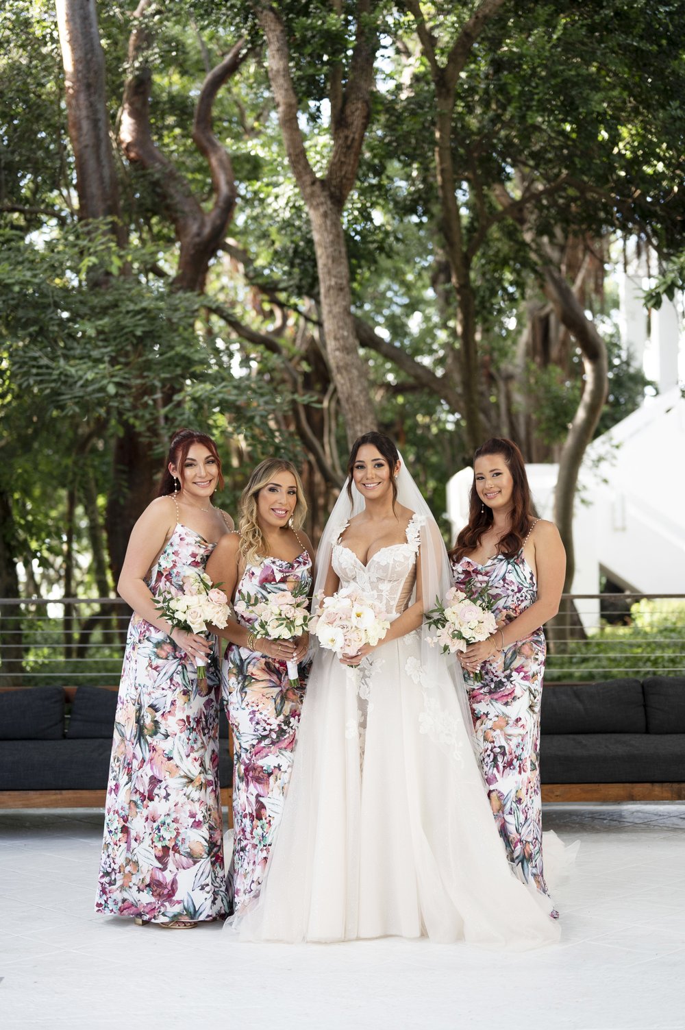 bride and bridesmaids posing 