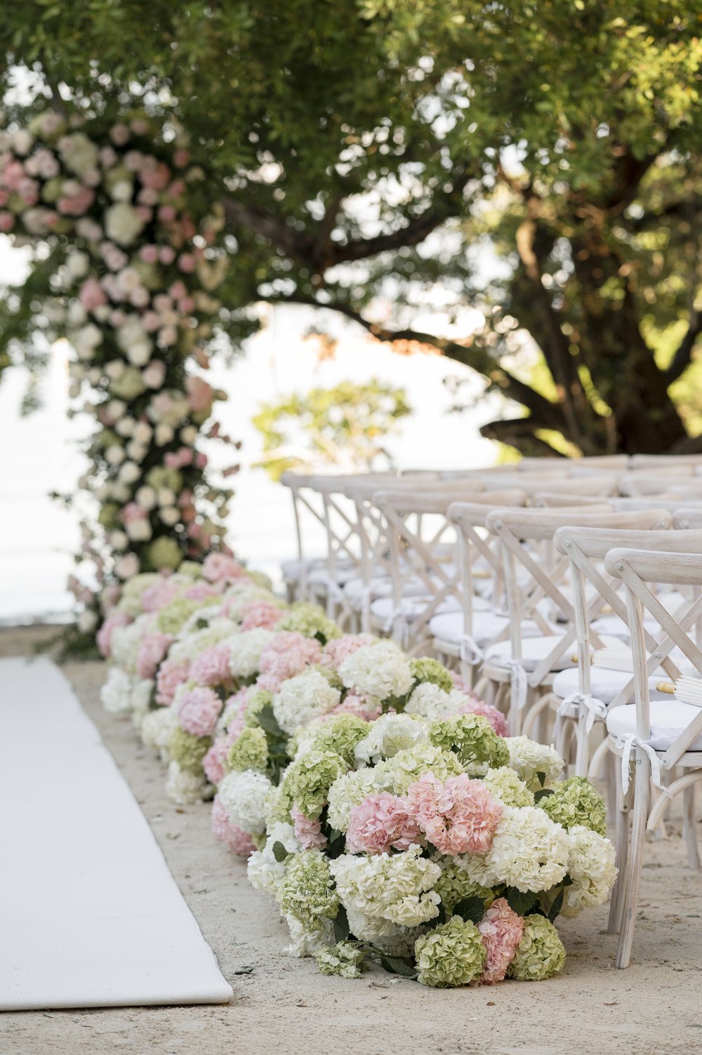 flowers design on a isle of a ceremony  beach wedding
