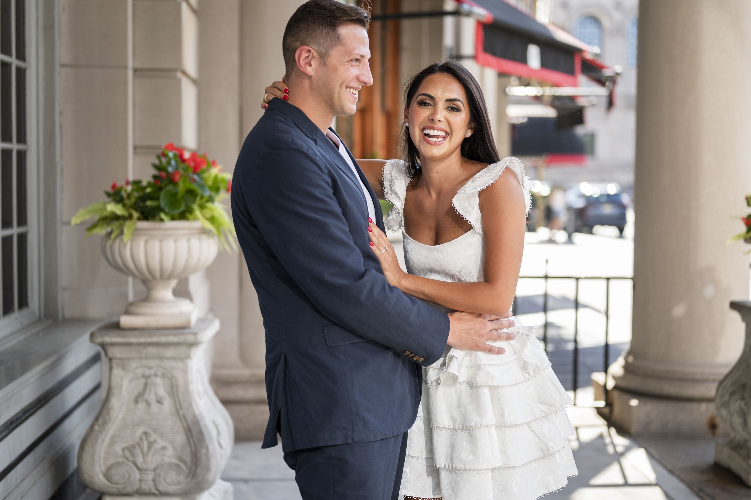 girl and guy hugging each other as they laugh