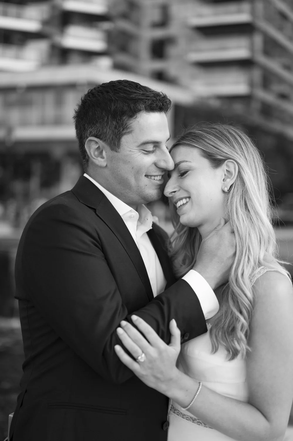 close up of bride and groom hugging