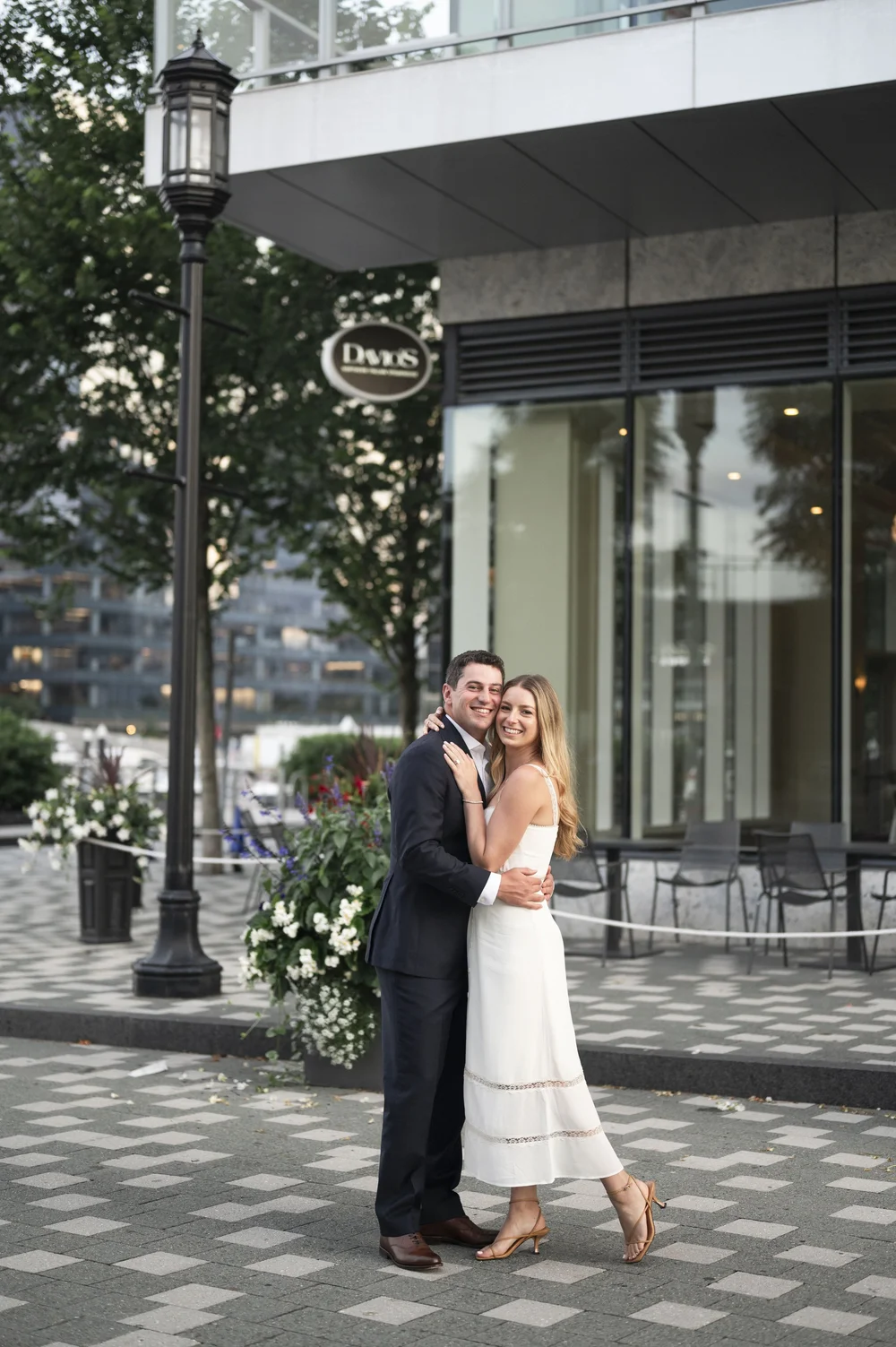 bride and groom posing in the middle of a street