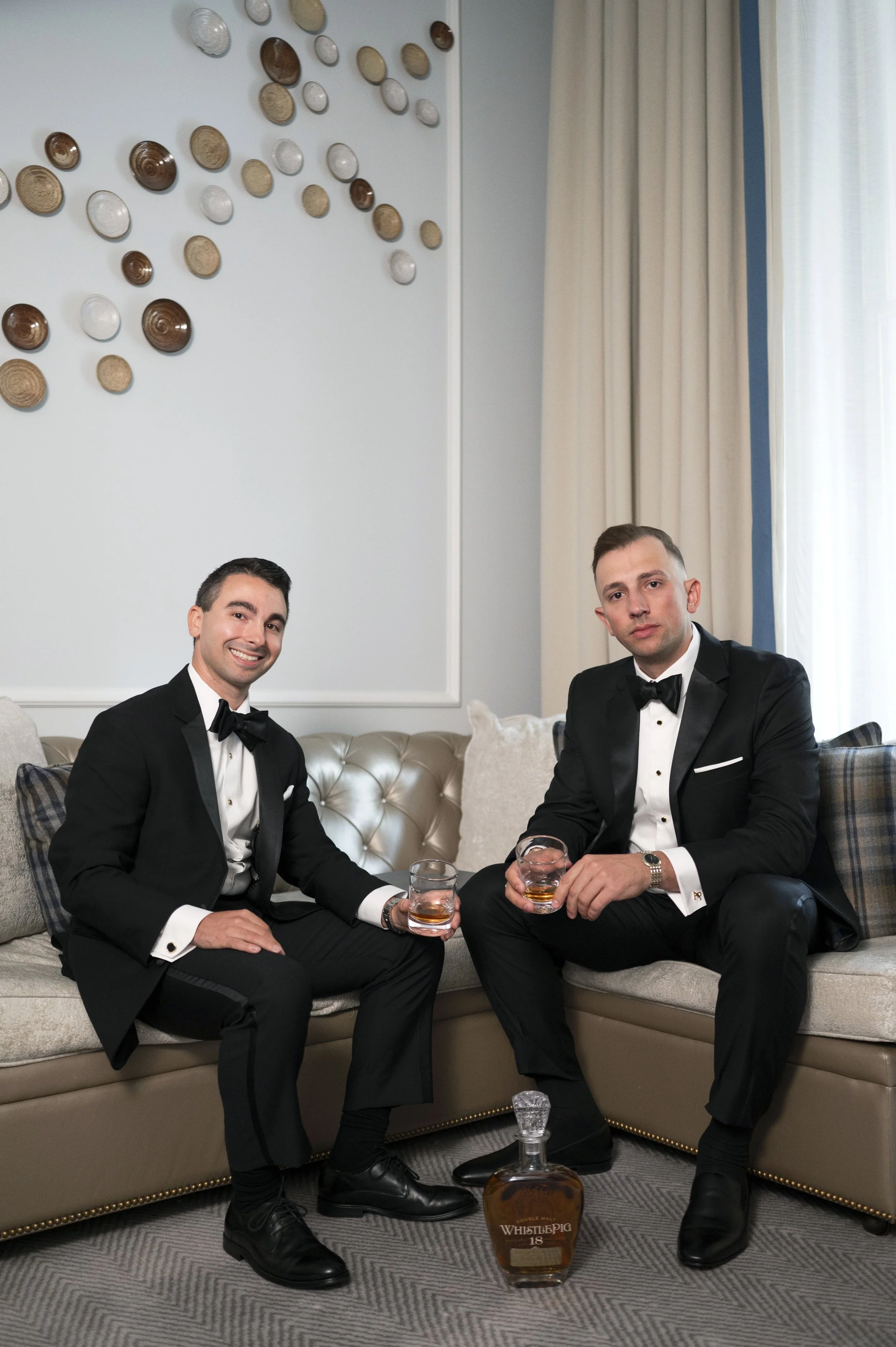 goom and best men sharing a drink