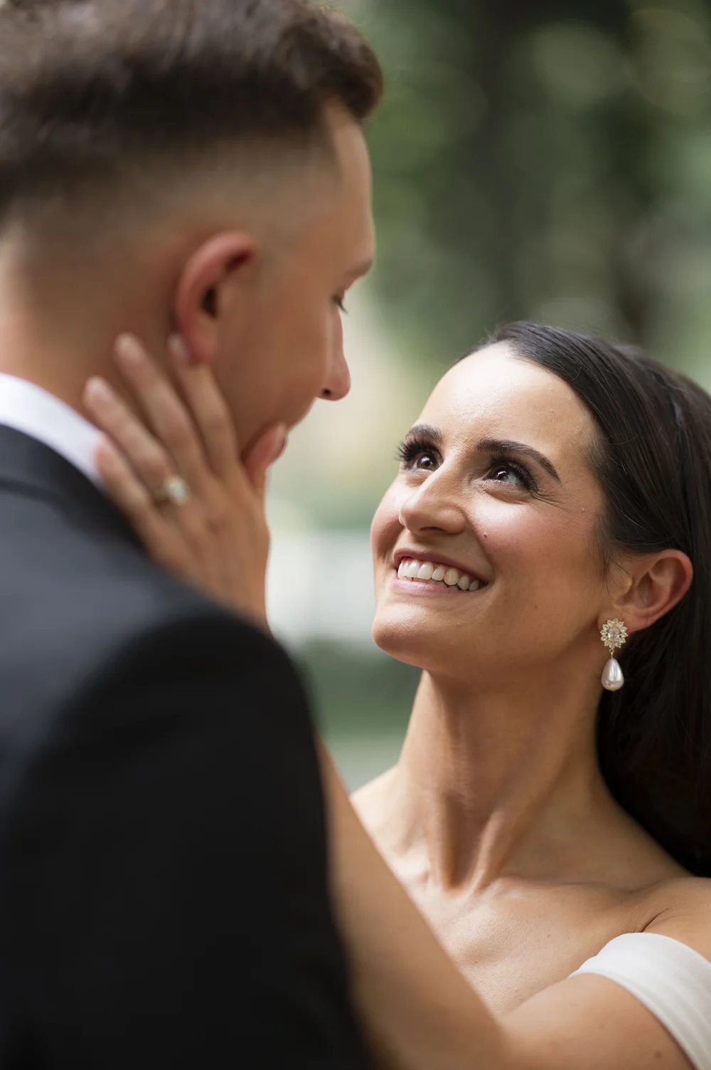  bride and groom looking at each other 