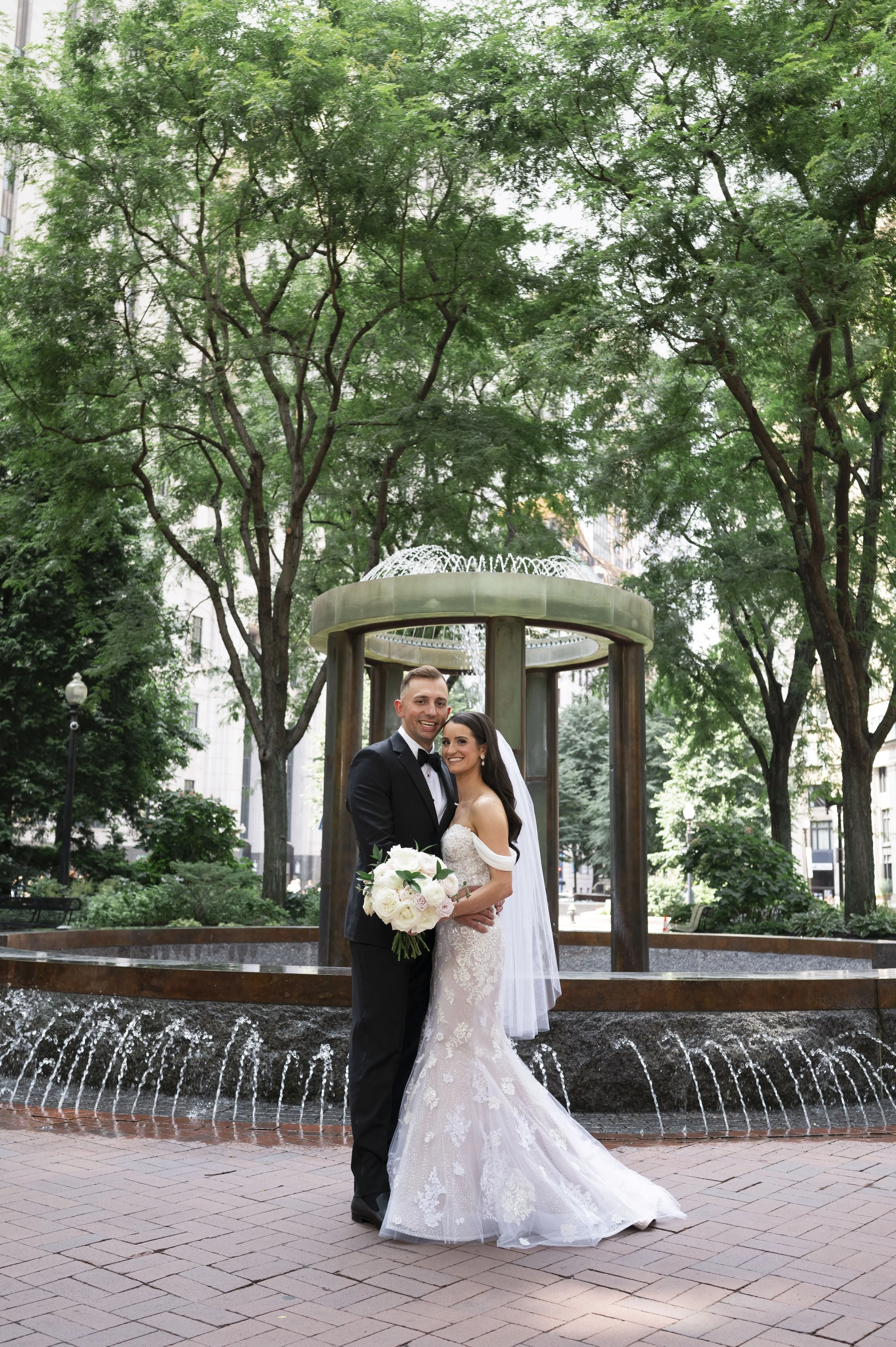  bride and groom posing in the park 