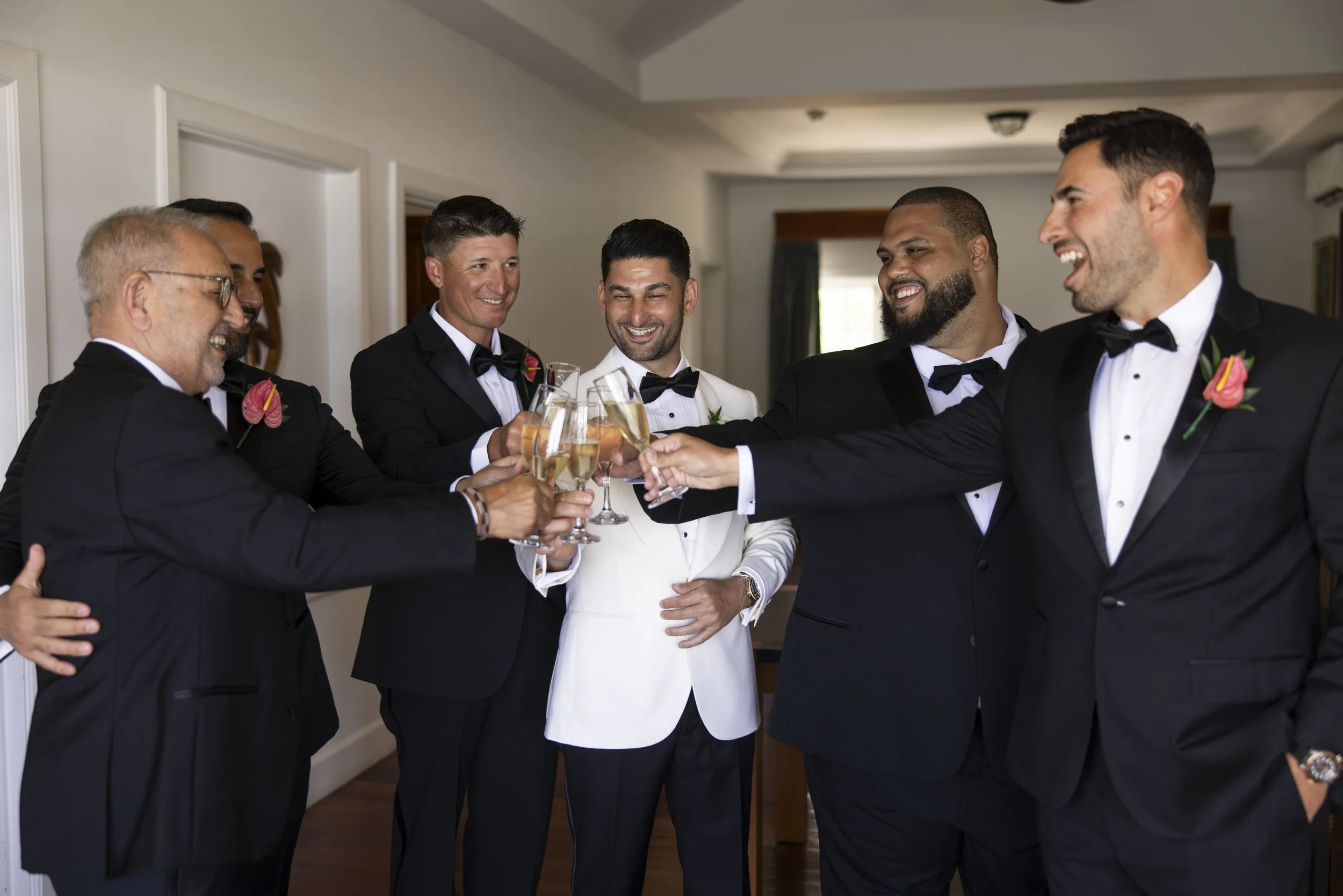 groom toasting with his groomsmen