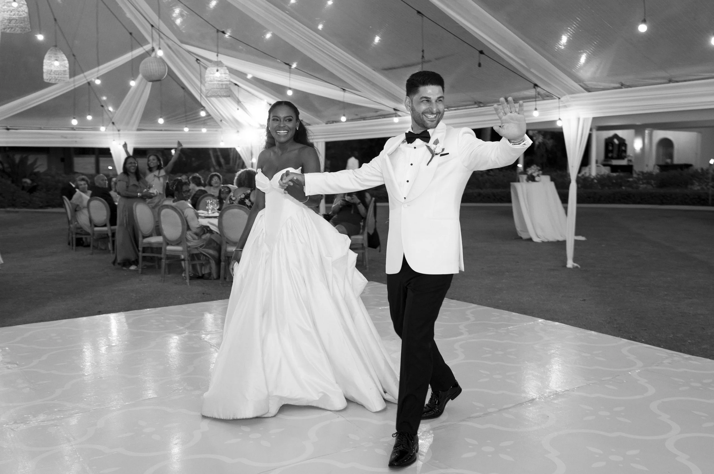 bride and groom entering their reception