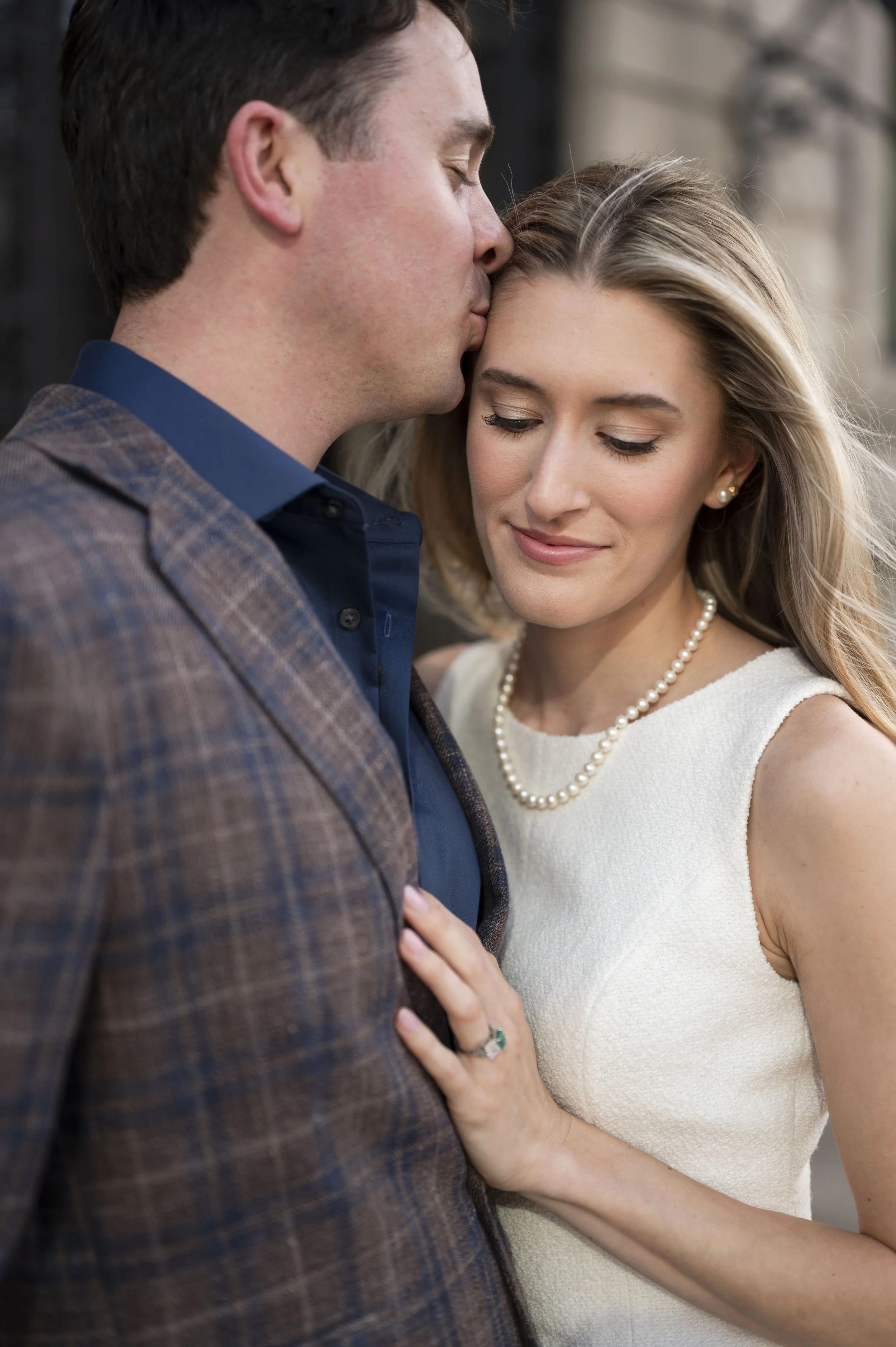Close up of Cathryn and Brendan hugging in front of Boston Public Library during their engagement session