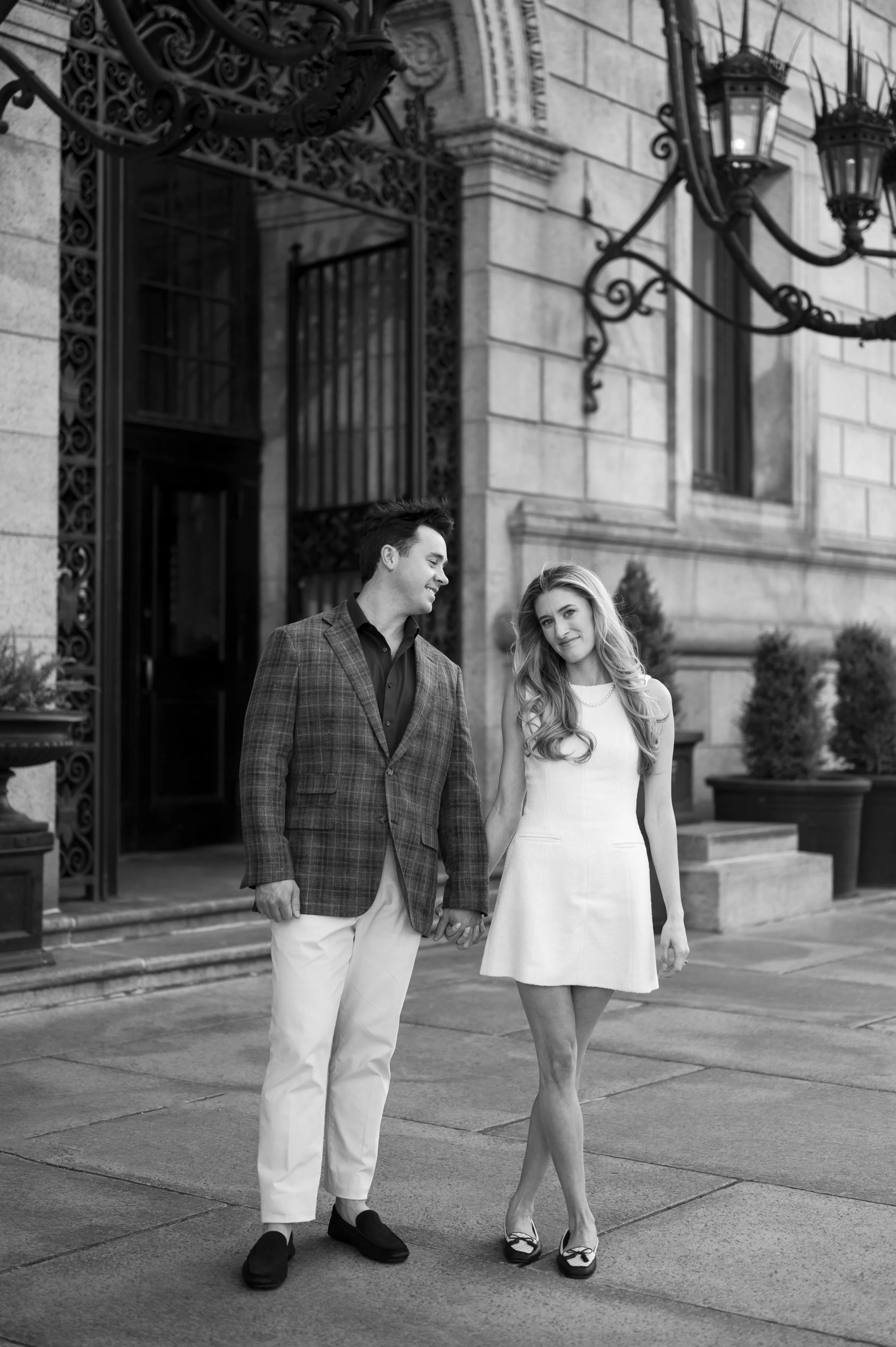 Cathryn and Brendan posing in front of the Boston Public Library during their engagement session