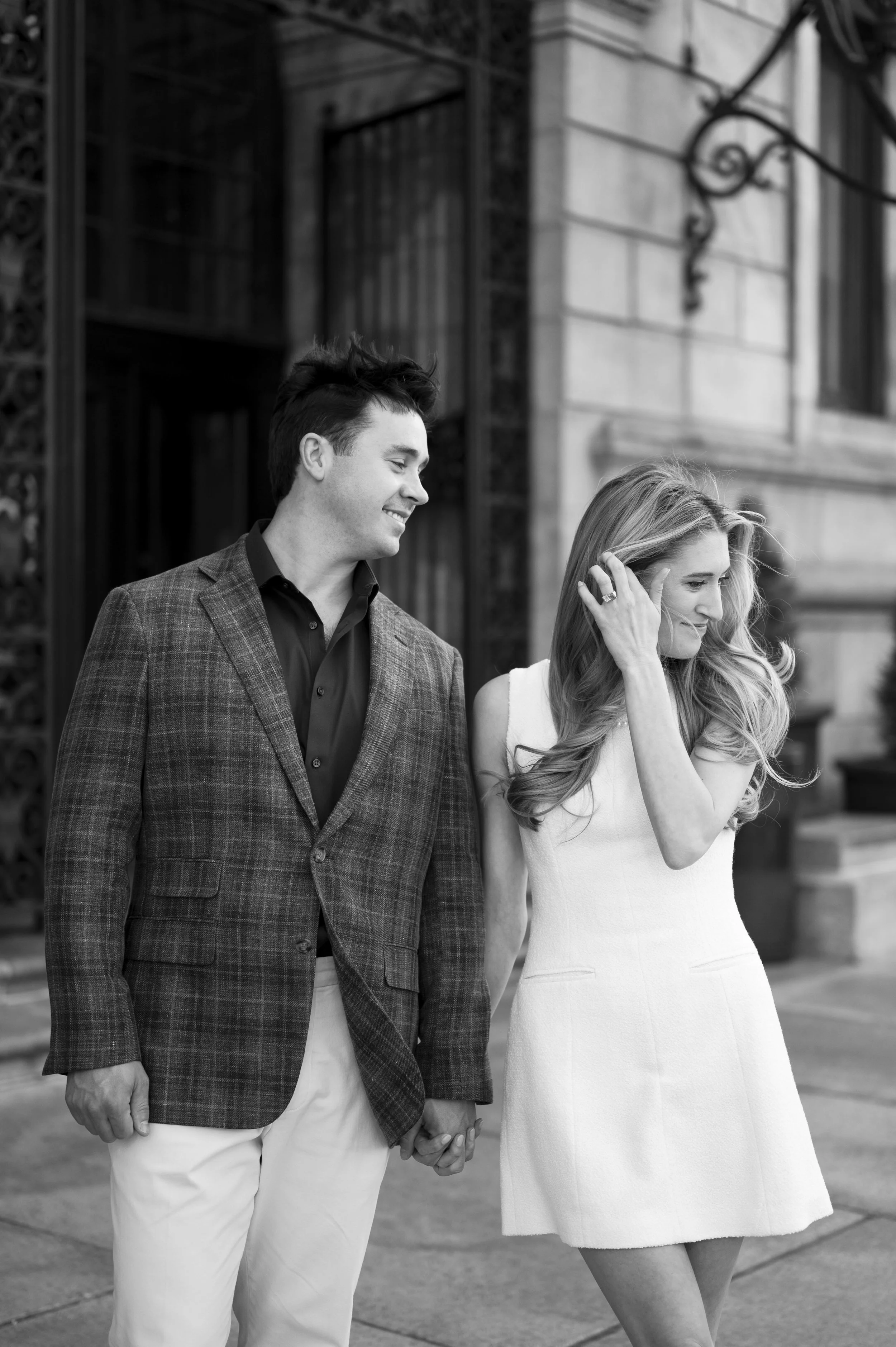 Cathryn and Brendan posing in front of the Boston Public Library during their engagement session