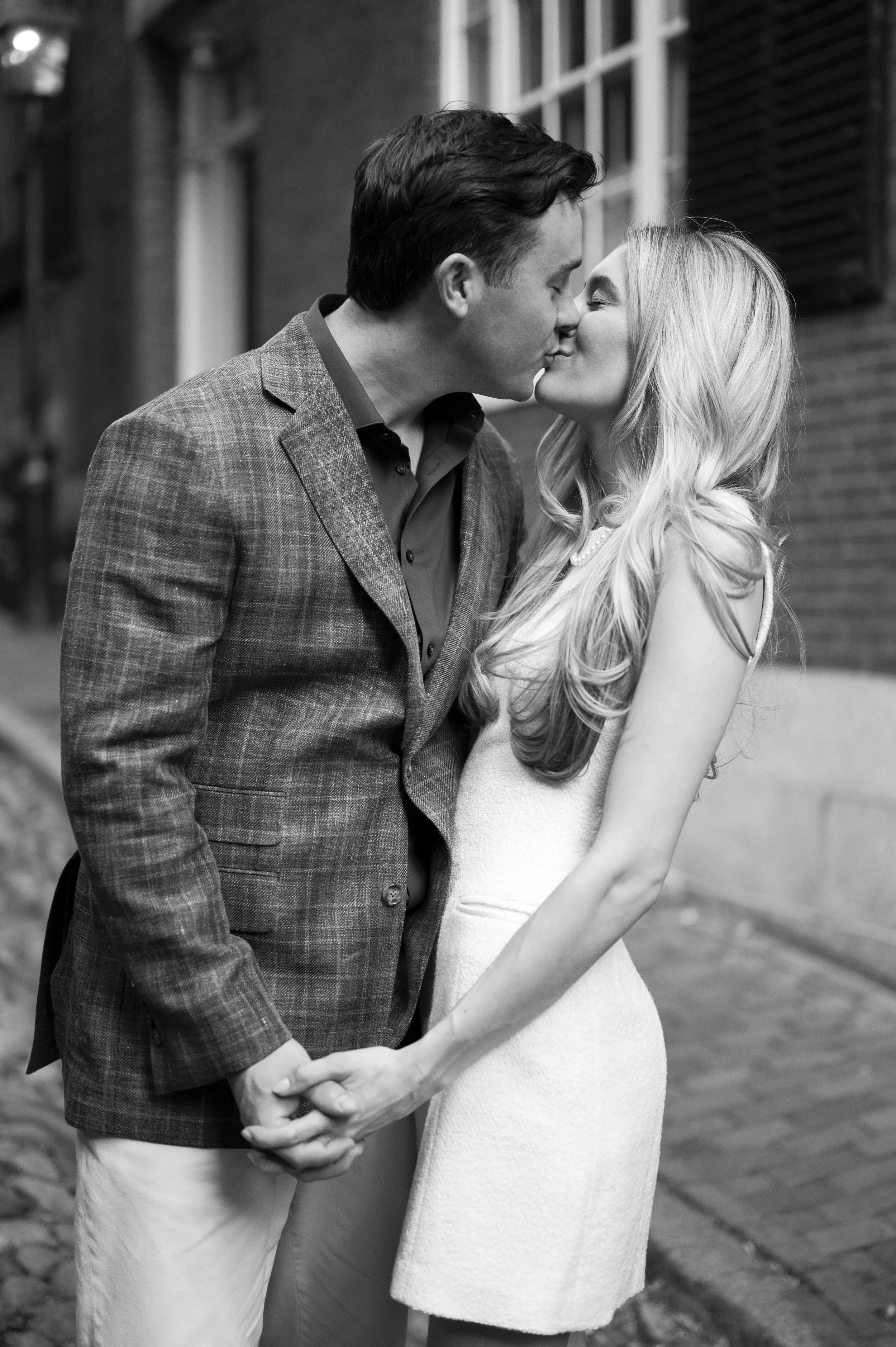 Cathryn and Brendan kissing at Acorn street in Boston during their engagement sessions