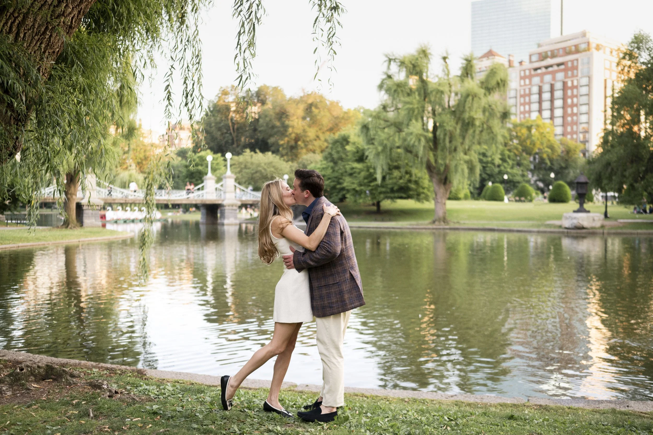 Cathryn and Brendan walking through Boston Public garden during their engagement session