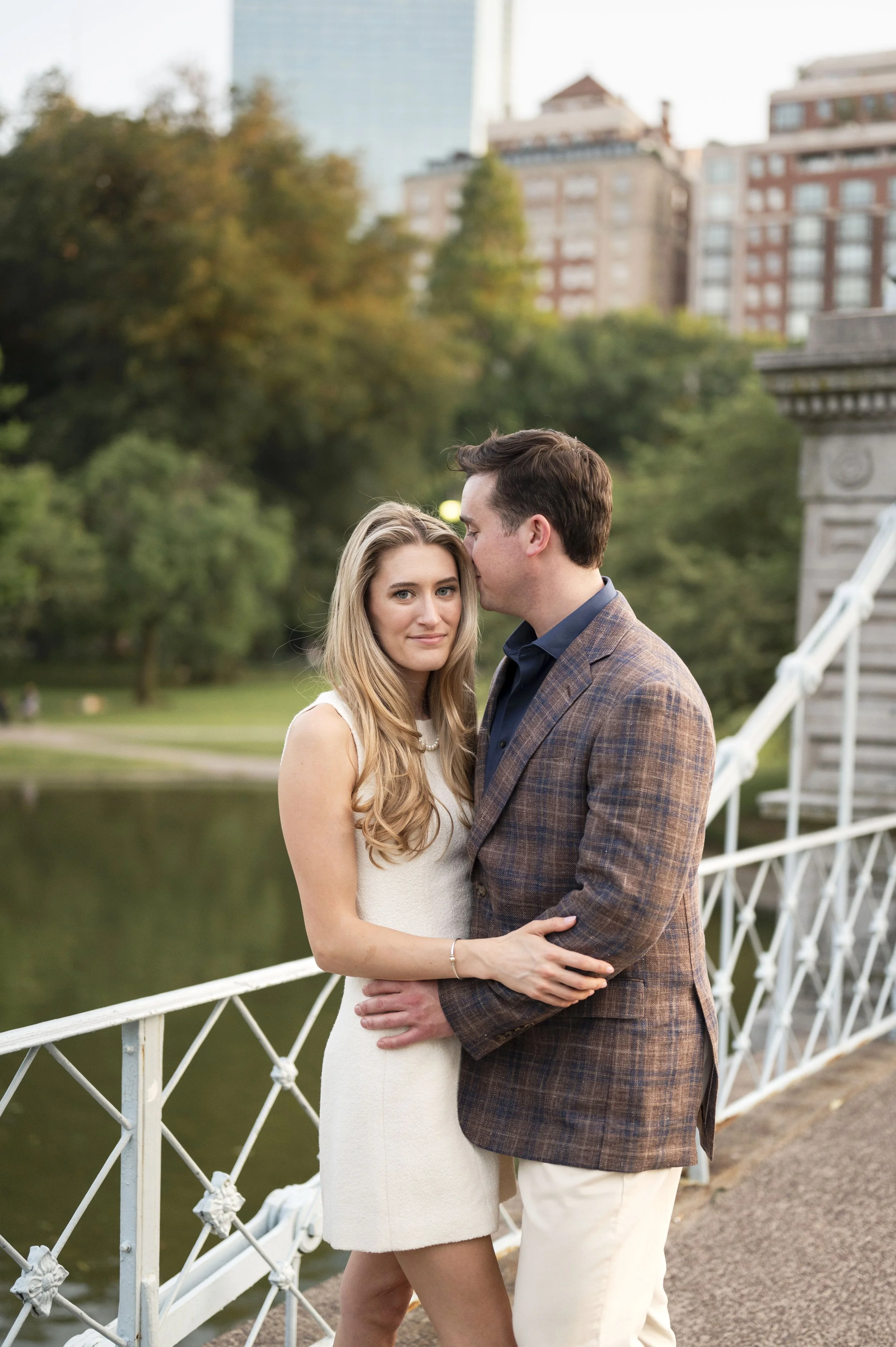 Cathryn and Brendan Hugging eachother at the public garden bridge during their engagement session