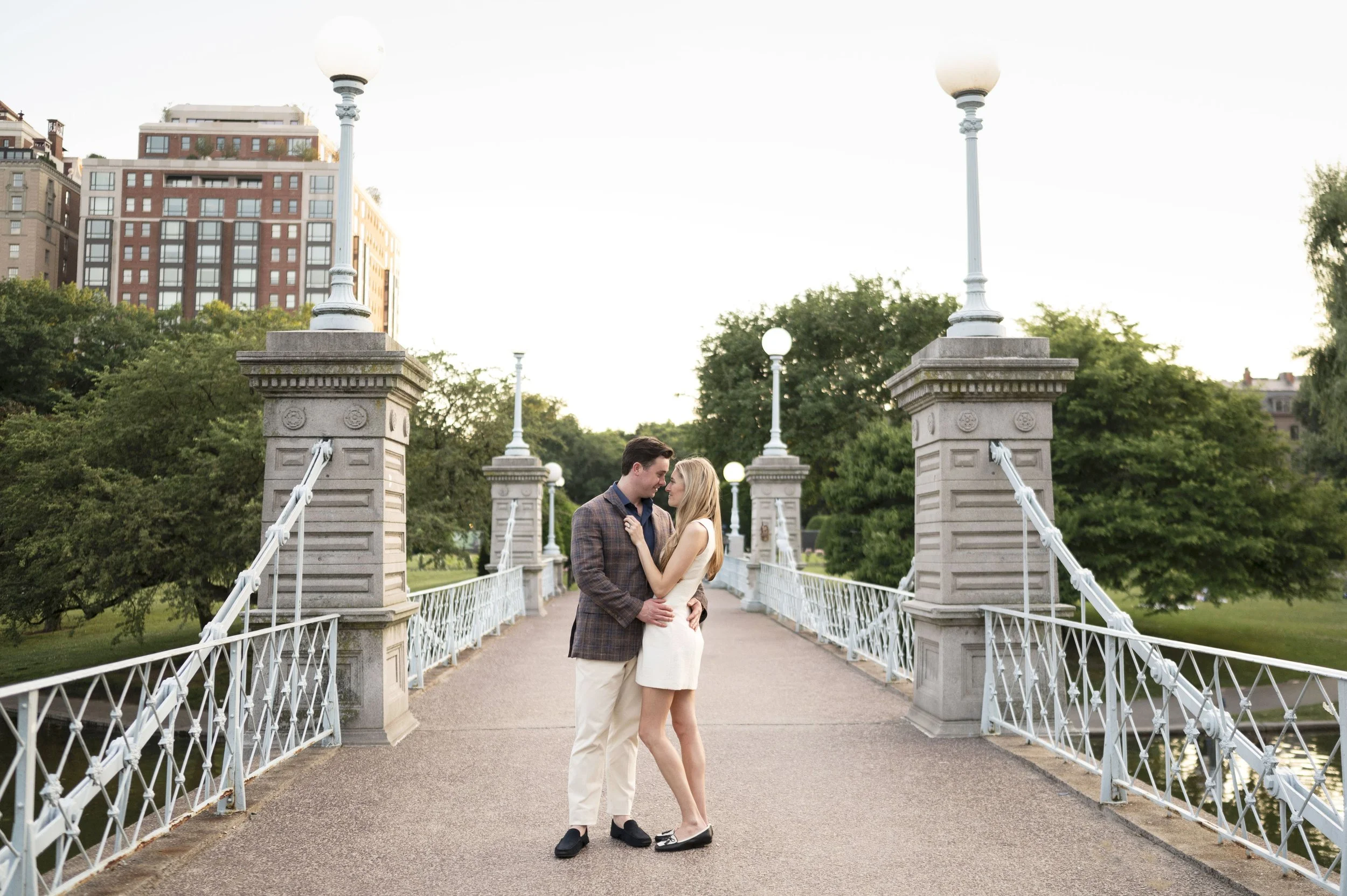 Cathryn and Brendan posing at Boston Public garden during their engagement session