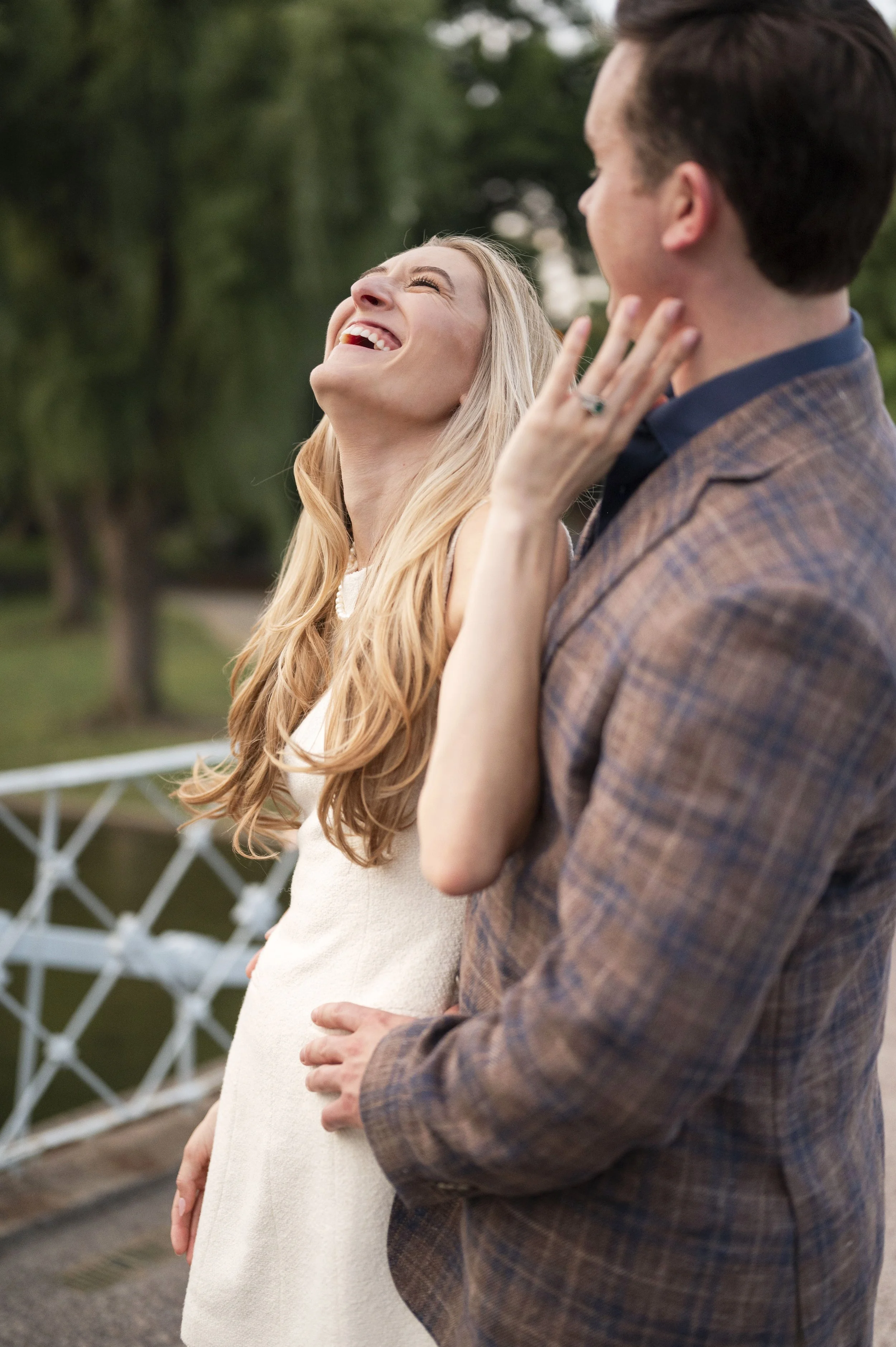 Cathryn and Brendan laughing at the public garden during their engagement session 