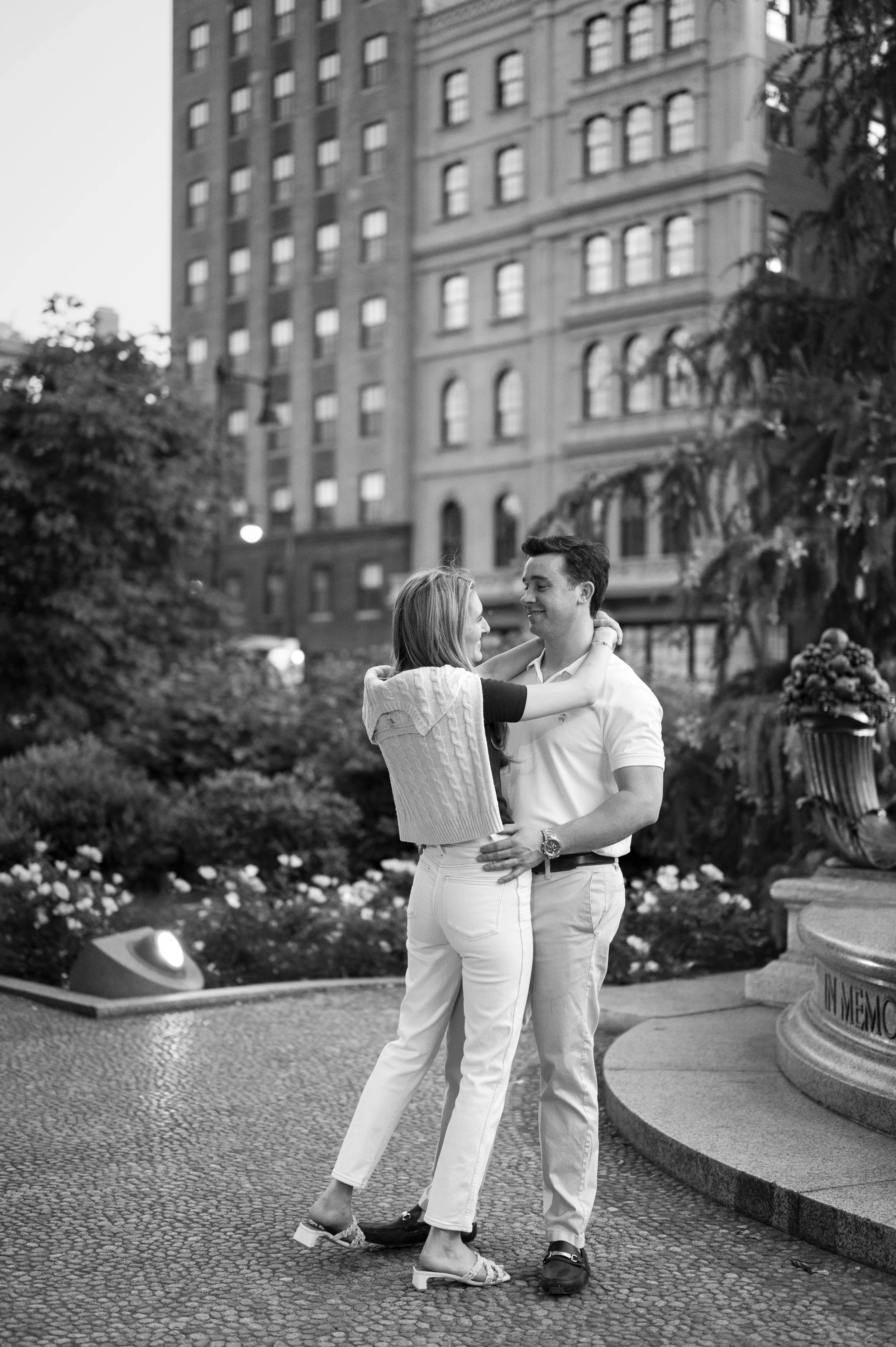 Cathryn and Brendan Hugging next to the boston public garden during their engagement session