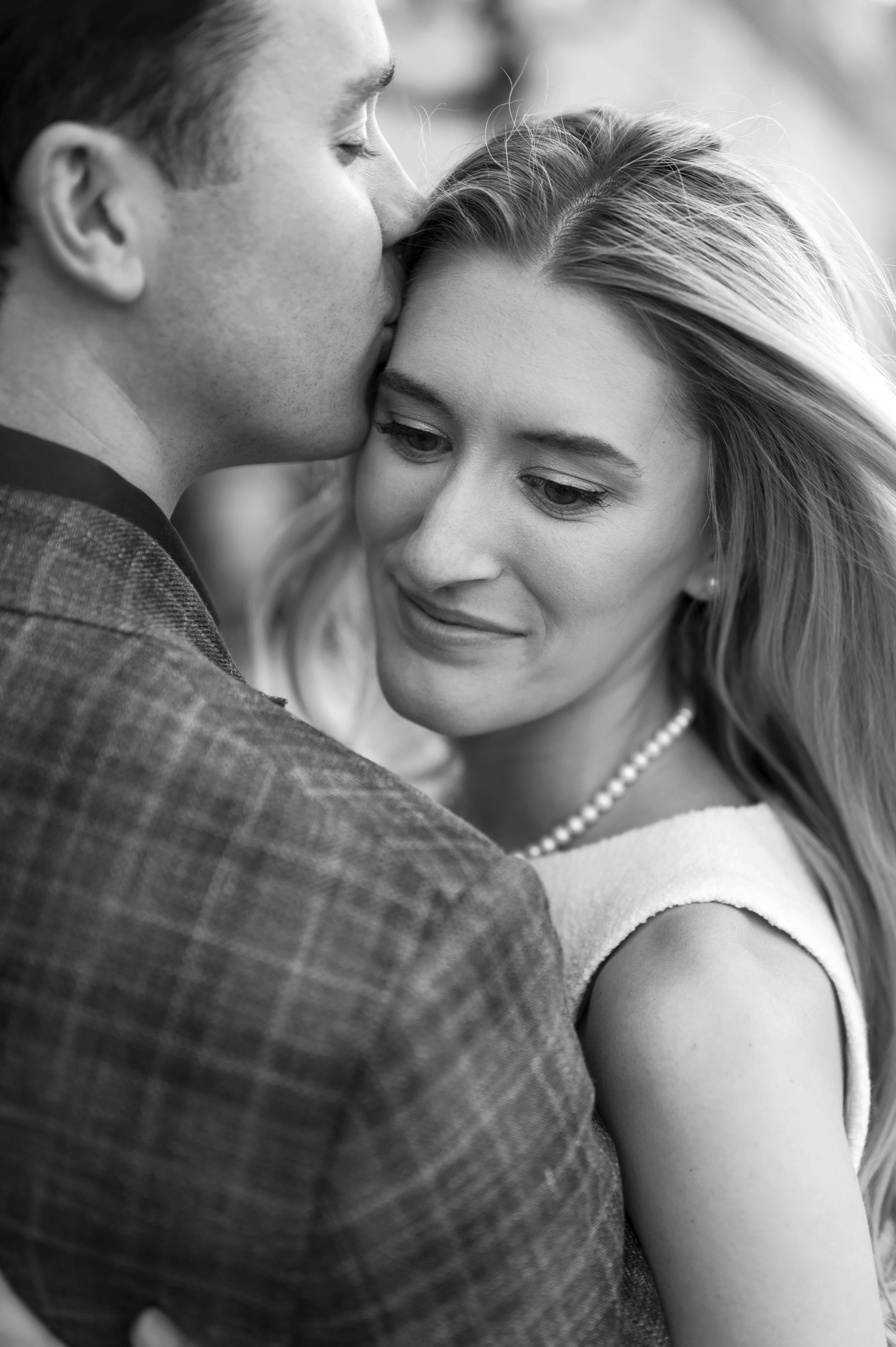 Close up of Cathryn being kissed by Brendan during their boston engagement session