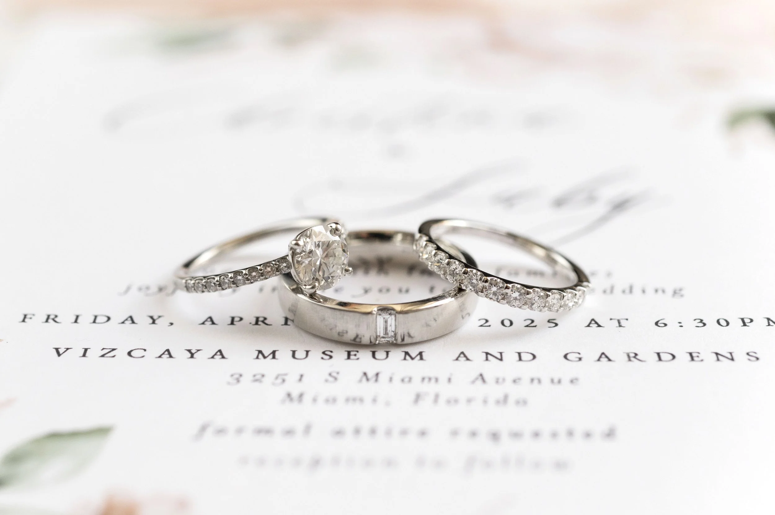 detail of rings on top of a Vizcaya museum wedding invitation in miami