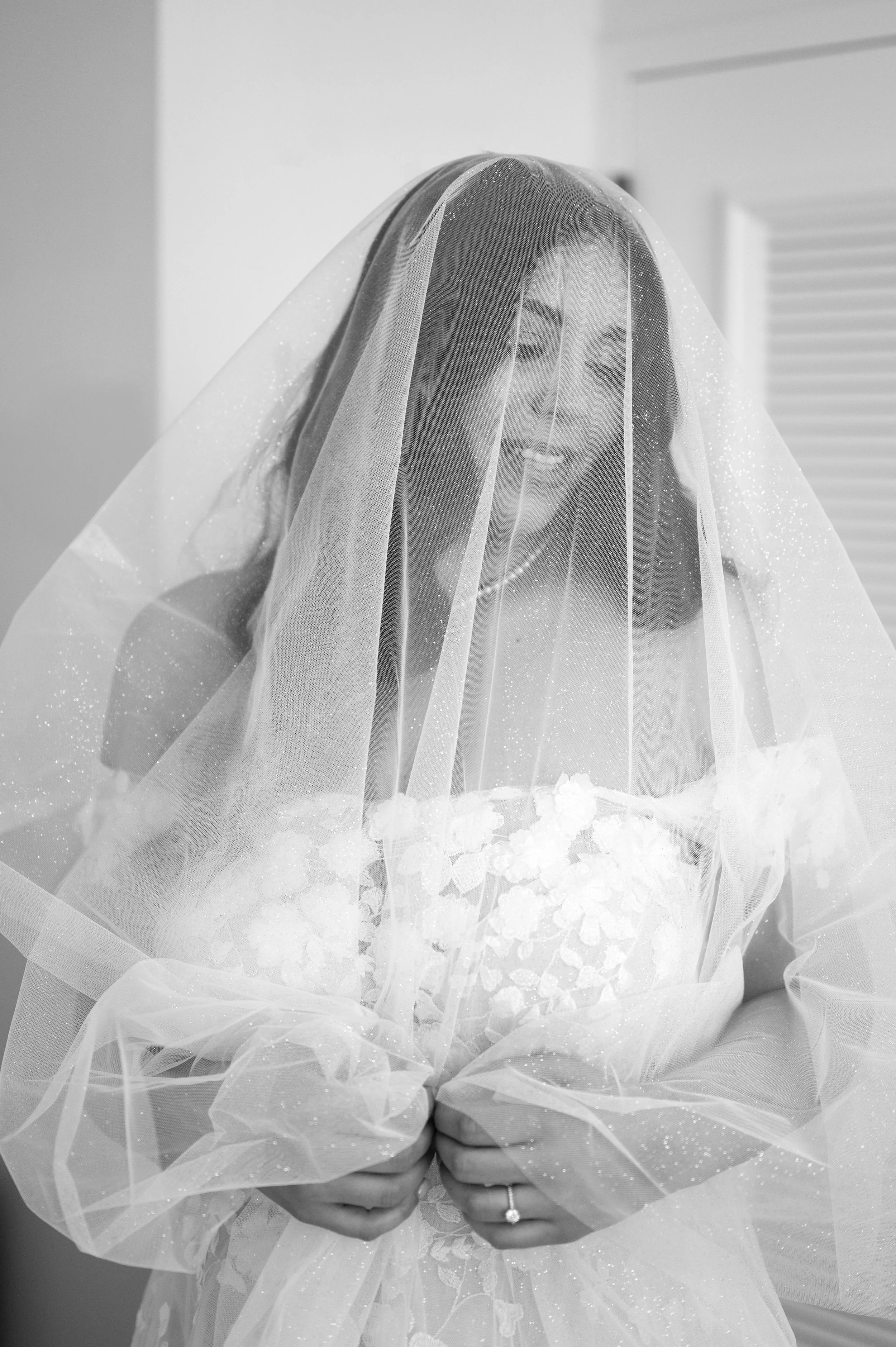 detail of bride with her veil over her head getting ready for her vizcaya museum wedding in Miami